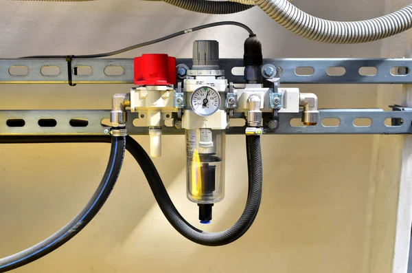 Water pressure sensor in the water supply system. Pressure gauge mounted on piping system with expansion tanks in boiler room.  Modern heating equipment.