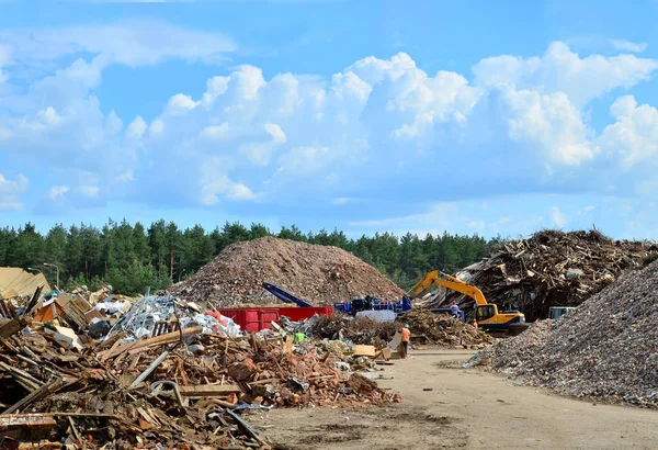 Industrial waste treatment processing plant. Landfill with industrial waste. Construction waste process, concrete recycling, crushing and recycling of construction mixed waste and demolition material