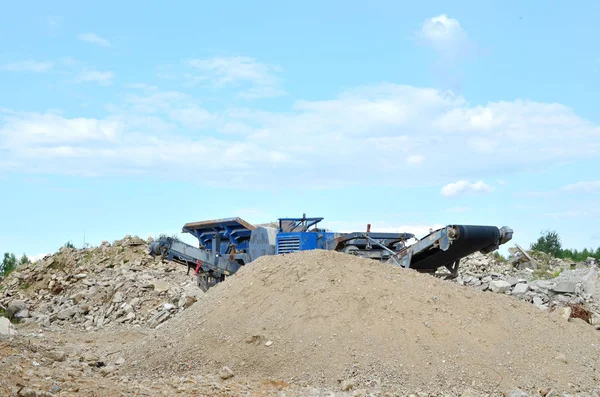 Concrete recycling shredding machine. Modern building techniques concrete processing, crusher and processing asphalt concrete, stones and rebar shredder. Reinforced concrete mobile shredder - Image