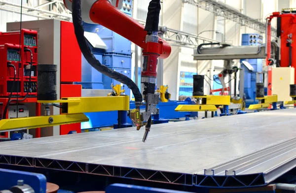 Robotic welding complex in the production workshop factory for the  manufacturing of modern rail transport and locomotives. Weld seam tracker, robotersysteme. Cutting, measuring and welding technology