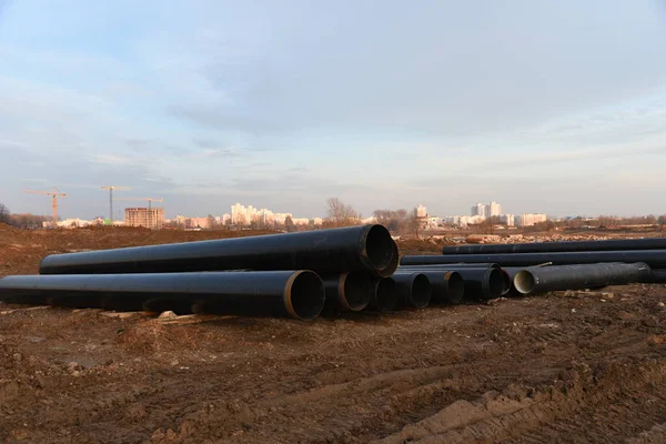 Cast iron sewer pipes for laying an external sewage system at a construction site. Sanitary drainage system for a multi-story building. Civil infrastructure pipe, water lines and storm sewers