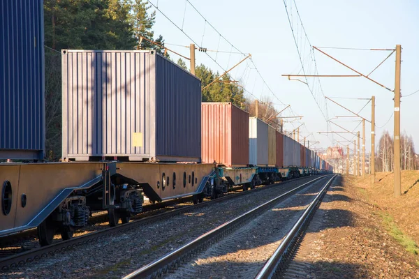 Cargo containers transportation on freight train by railway. Coronavirus Wreaks Havoc On Global Industry. Global economy is heading into a recession thanks to the widening fallout from the COVID-19