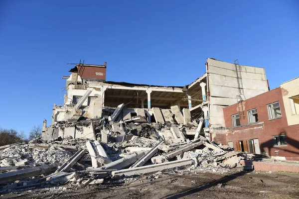 View of the demolition of a multi-storey building. Dismantling and demolition of buildings and structures. Destroy concrete