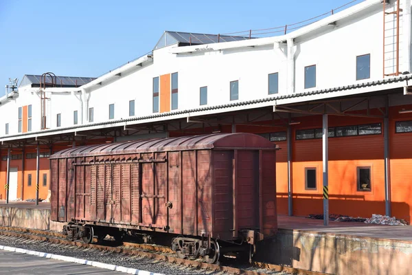 Loading and unloading of railway cars, boxcar and containers at temporary storage warehouses. Customs warehouse with a ramp. Access railway (railway dead end) passes through the customs control area