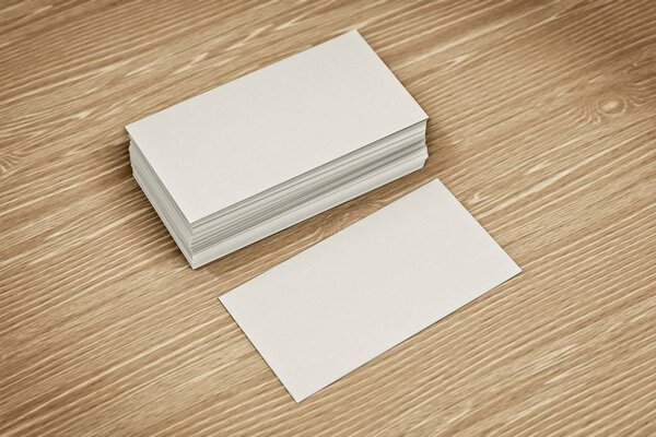 Blank bussiness cards on wood background. Mockup for ID. Template for promotion of corporate identity.
