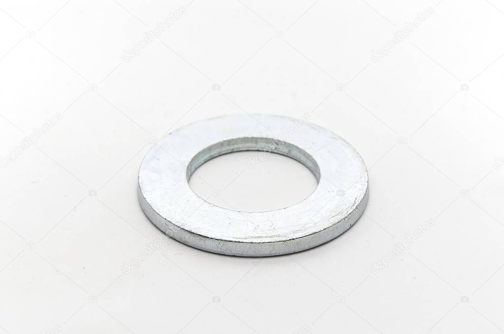 Steel nut, bolt and washers on white background