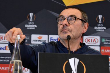 KYIV, UKRAINE - MARCH 14, 2019: Chelsea manager Maurizio Sarri attends press-conference after the UEFA Europa League game against FC Dynamo Kyiv at NSC Olimpiyskyi stadium in Kyiv, Ukraine clipart