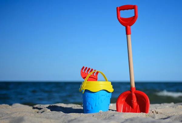 Children Toys Bucket Shovel Sandy Beach Background Blue Sky Sea Royalty Free Stock Photos