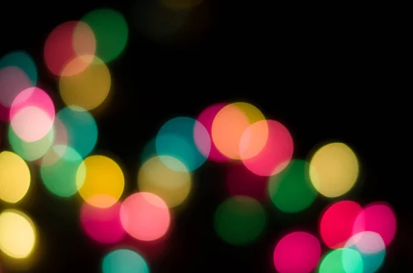 Beautiful multicolored bokeh on black — Stock Photo, Image