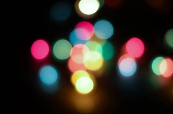 Beautiful multicolored bokeh on black — Stock Photo, Image