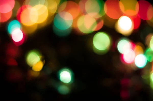 Beautiful multicolored bokeh on black — Stock Photo, Image