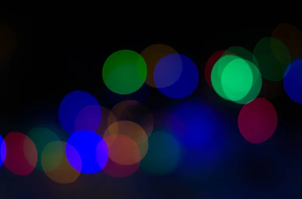 Beautiful multicolored bokeh on black — Stock Photo, Image