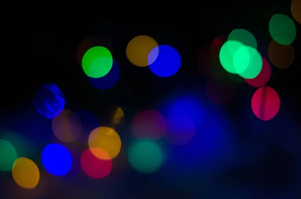 Beautiful multicolored bokeh on black — Stock Photo, Image