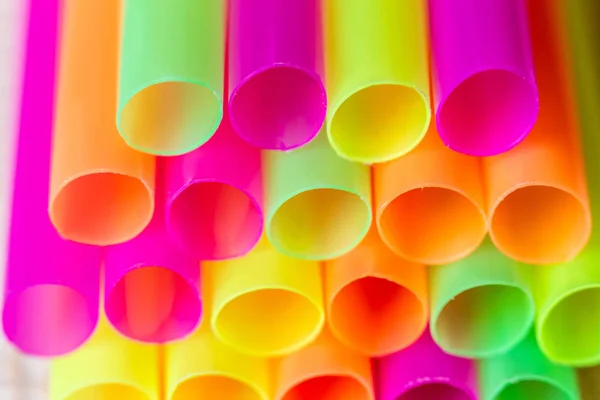 Group Of Plastic Straws For Drinks. Colorful Tubes. Abstract Background