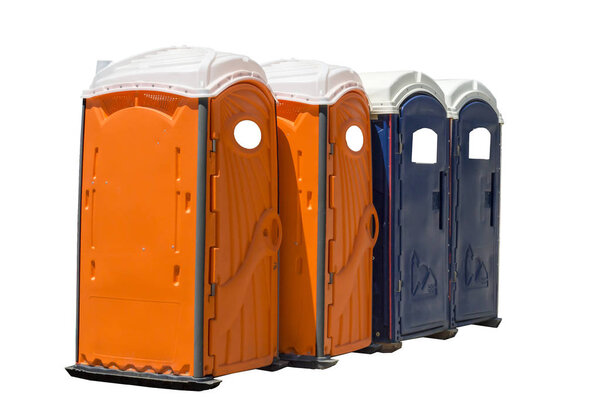 Horizontal Shot of Four Bright Colored Portable Potties.  Two are orange and two are dark blue.  Isolated on white.