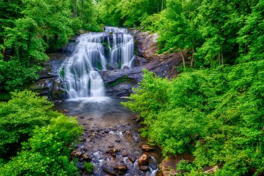 Wide perspective horizontal shot of the beautiful Bald River Falls in Tennessee. clipart