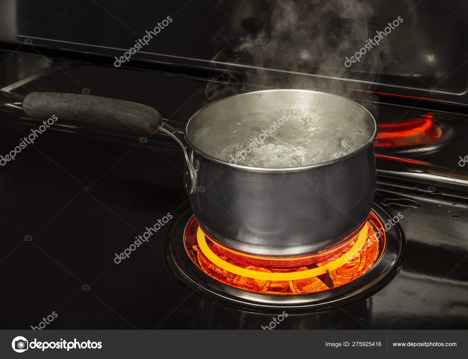 Boiling Pot of Water on Stove With Copy Space Stock Photo by