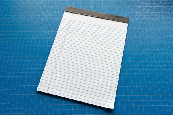 Blank White Legal Pad With Copy Space Against Blue Background — Stock Photo, Image