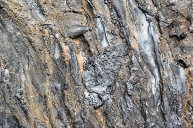 Otojen kaynak makinesi tasarım arka plan için kesilmiş kalın metal bir parça