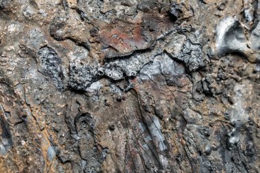 Otojen kaynak makinesi tasarım arka plan için kesilmiş kalın metal bir parça