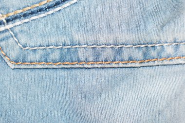 Tasarım arka plan için dikişler ile mavi denim kumaş