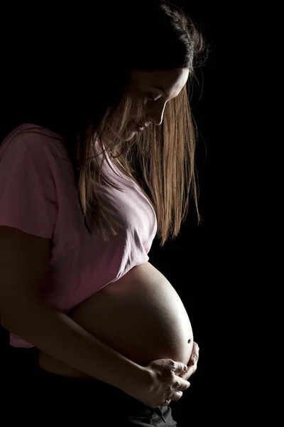 Silhouette Una Bella Donna Incinta Uno Sfondo Nero — Foto Stock