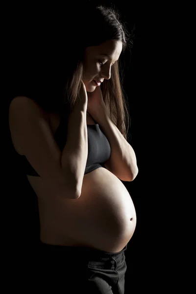 Silhouette Una Bella Donna Incinta Uno Sfondo Nero — Foto Stock