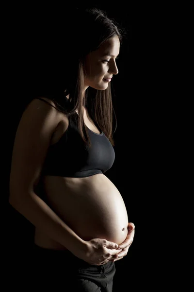 Silhouette Una Bella Donna Incinta Uno Sfondo Nero — Foto Stock