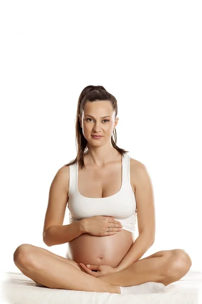 Young Pregnant Woman Sitting Bed Lotus Position White Background — Stock Photo, Image