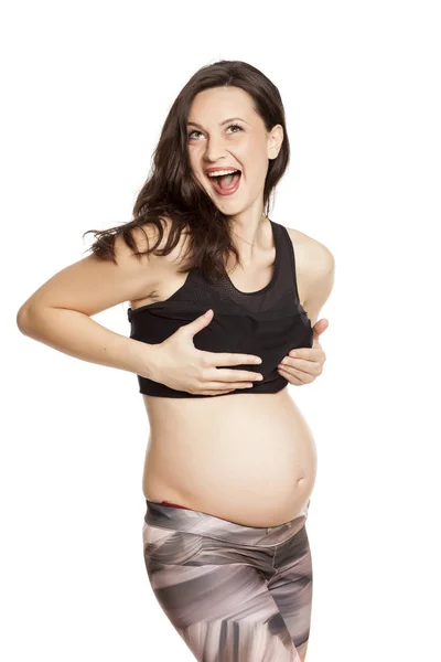 Mujer Embarazada Conmocionada Tocándose Los Pechos Sobre Fondo Blanco —  Fotos de Stock