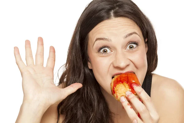 Craving Young Woman Eating Cherry Topping Donut White Background — Stock Photo, Image