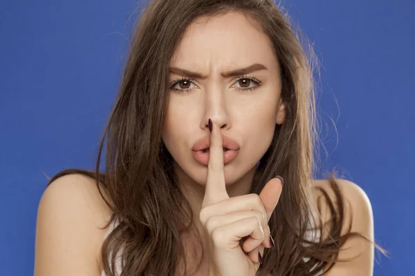 Angry Beautiful Woman Blue Background Making Silence Gesture — Stock Photo, Image