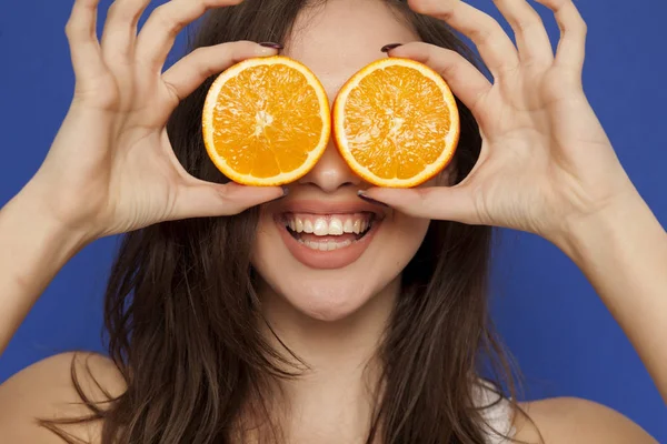 Happy Young Woman Posing Slices Orange Her Face Blue Background — Stock Photo, Image