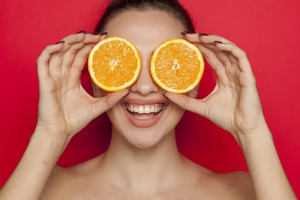Happy Young Woman Posing Slices Orange Her Face Red Background — Stock Photo, Image