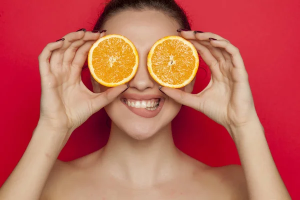 Happy Young Woman Posing Slices Orange Her Face Red Background — Stock Photo, Image