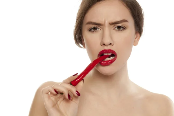 Young Sexy Woman Holding Chili Pepper Her Teeth White Background — Stock Photo, Image