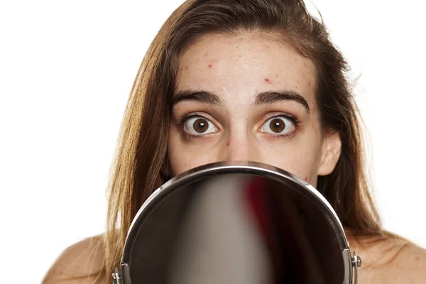 Young Unhappy Woman Problematic Skin Makeup Peeking Mirror White Background — Stock Photo, Image