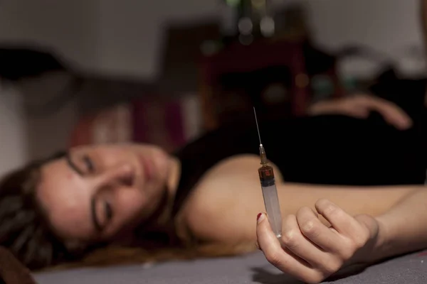 Drugged Girl Lying Floor Syringe Her Hand — Stock Photo, Image