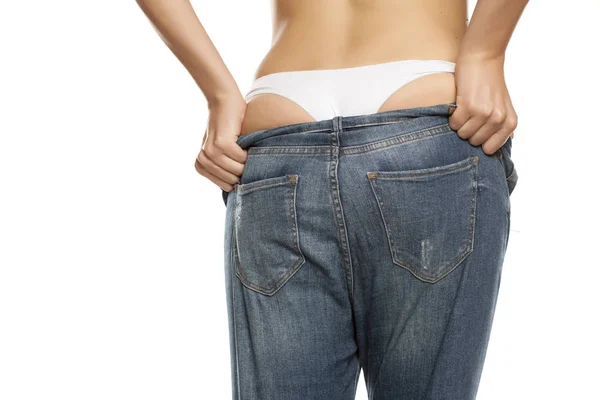 Rear View Young Woman Trying Put Her Tight Jeans White — Stock Photo, Image