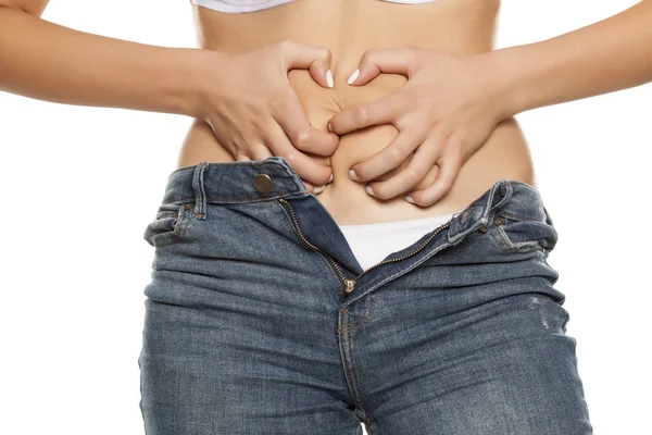 Young Woman Pinching Fat Her Belly White Background — Stock Photo, Image