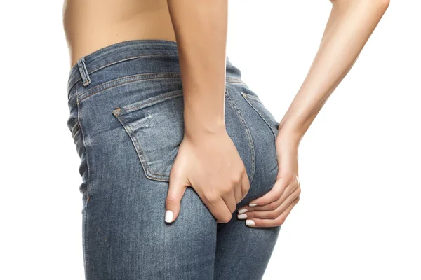 Young Woman Jeans Lifting Her Buttocks White Background — Stock Photo, Image