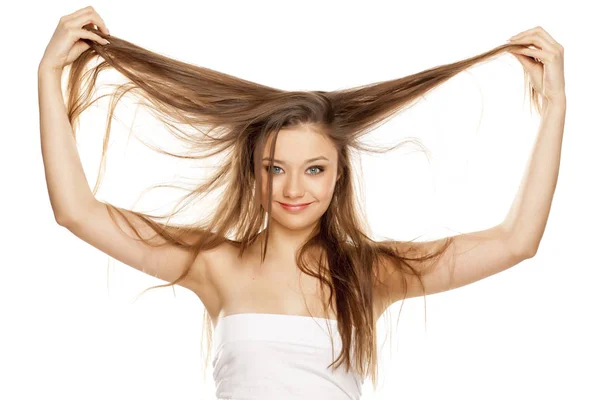 Young Blonde Showing Her Long Straight Hair White Background — Stock Photo, Image