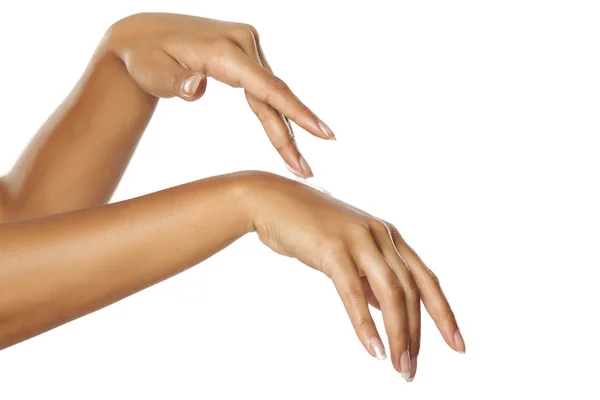 Closeup Female Dark Skunned Hands Applying Hand Cream White Background — Zdjęcie stockowe