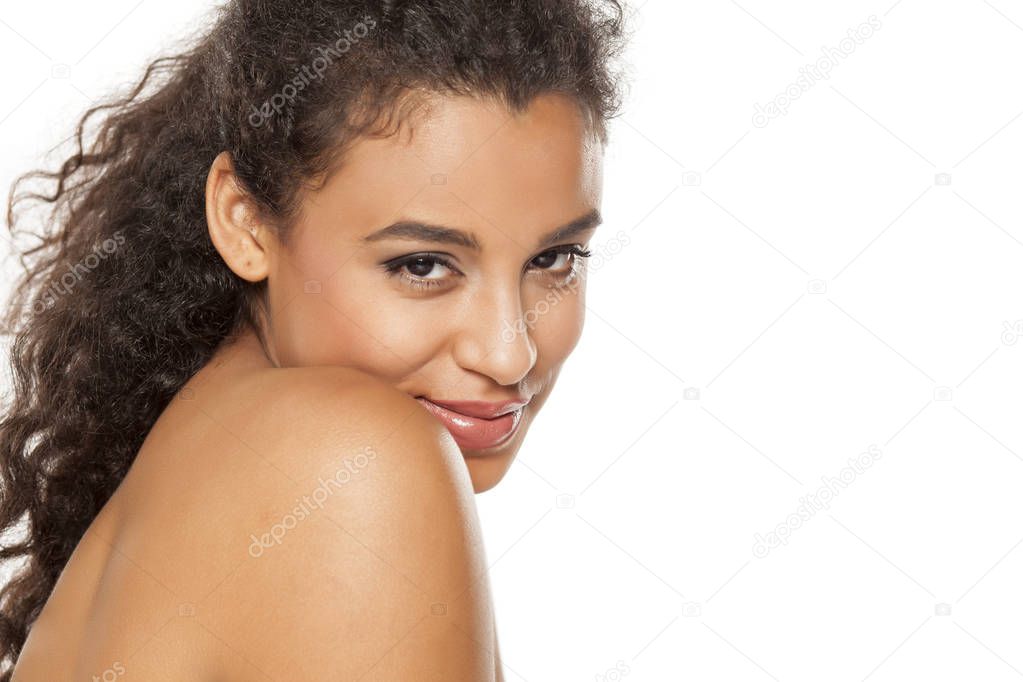 portrait of seductive young beautiful dark-skinned woman on a white background