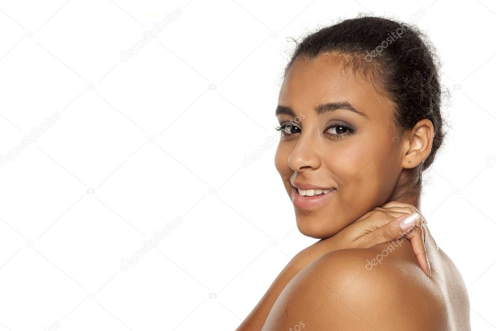 portrait of young beautiful dark-skinned woman posing on a white background