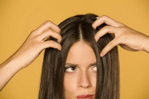 Beautiful Young Woman Itchy Scalp Yellow Background — Stock Photo, Image