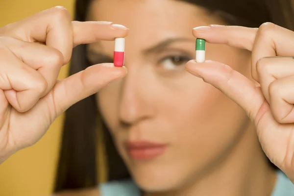 Closeup Woman Holding Capsules Her Fingers — Stock Photo, Image