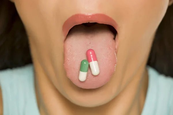 Closeup Woman Holding Capsules Her Tongue — Stock Photo, Image