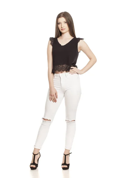 Mujer Joven Jeans Blancos Tacones Altos Sobre Fondo Blanco — Foto de Stock