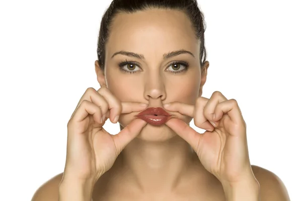 Young Woman Touching Her Lips Her Fingers White Background — Stock Photo, Image